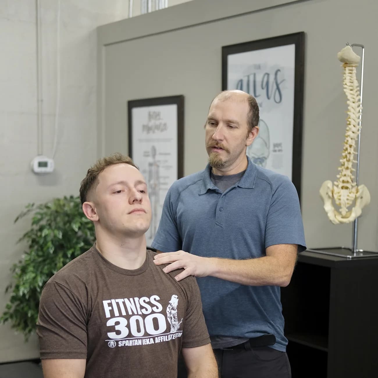 Dr. Porter smiling with a patient during care at Functional Chiropractic in Huntsville